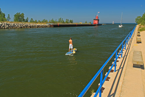 standup paddle boarding through the holland harbor